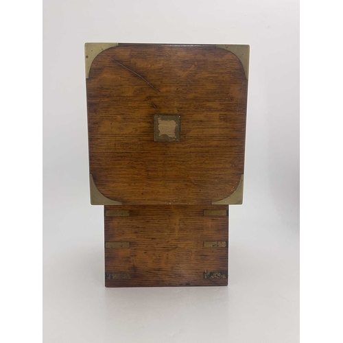 198 - A 19th Century oak and brass bound decanter box, flush side handles, blue velvet fitted interior con... 