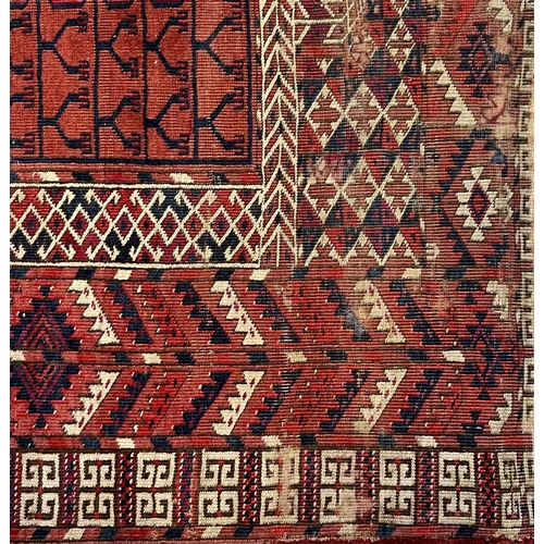 208 - Tekke Engsi rug, early 20th century, the rust red field with cruciform motif, within rust red serrat... 