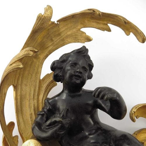 210 - A pair of bronze and gilt metal wall brackets, each with seated figure of a child, one with a tortoi... 