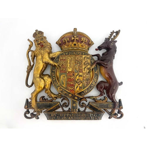 214 - A cast iron and enamelled Royal Warrant, for Queen Mary, circa 1920, with coat or arms and supporter... 