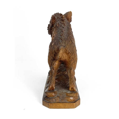 221 - A Black Forest carved wood figure of a boar, 19th century, realistically modelled on a rocky outcrop... 