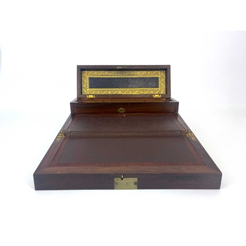 225 - A Regency rosewood writing compendium, circa 1820, brass inlaid, caddy top with a concealed velvet l... 