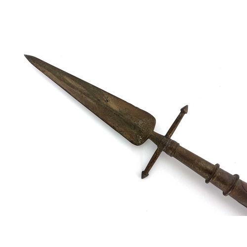 242 - A 19th century spontoon, mounted on a Continental carved shaft, the steel leaf blade with cross bar ... 