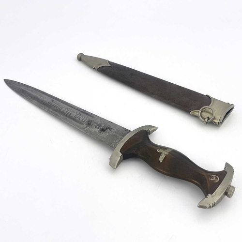 249 - A German WWII SA dagger, by Eickhorn, copper sheath and carved wooden handle inlaid with Third Reich... 