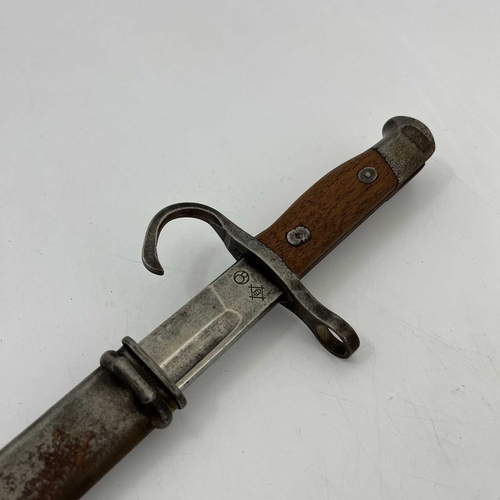 255 - A Japanese Type 30 sword bayonet, two piece wooden grip, housed in steel scabbard, Nagoya Army Arsen... 