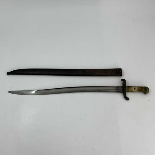 258 - A French M1874 Gras sword bayonet, two piece wooden grip, housed in steel scabbard, foundry marks to... 