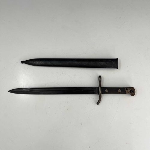 262 - Two bayonets, Finnish M1927 Mosin-Nagant sword bayonet by Fiskars, two piece wooden grip housed in s... 