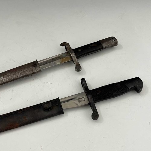 263 - Two bayonets, Portuguese M1885 Kropatshek sword bayonet, two piece wooden grip housed in steel scabb... 