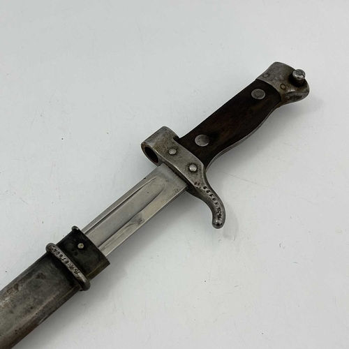 264 - A late 19th century French M1892 Mannlicher Berthier sword bayonet, two piece wooden grip and quillo... 