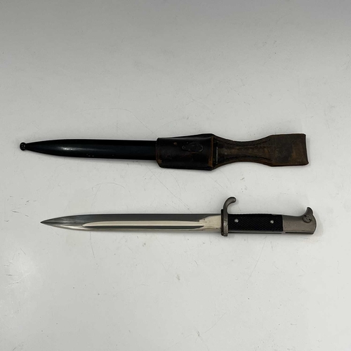 269 - Two German bayonets, including a Third Reich bayonet, two piece black chequered grip, housed in blac... 