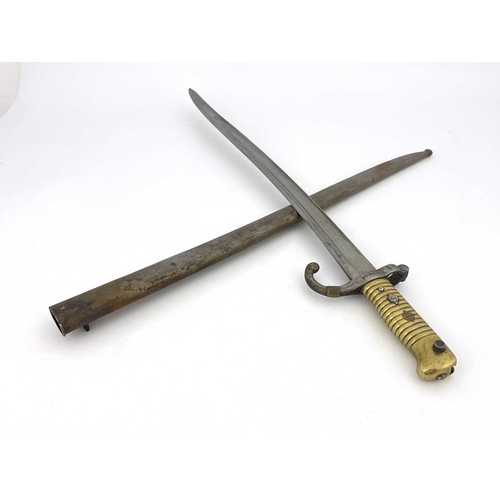 274 - A Dutch 1873 yataghan sword bayonet, brass grip and quillon, housed in steel scabbard, ricasso marke... 