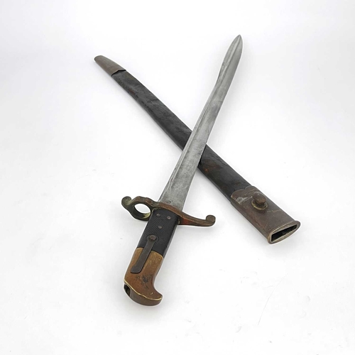 277 - A 19th century British Lancaster sword bayonet, two piece chequered and brass grip, housed in leathe... 