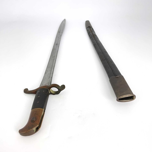 277 - A 19th century British Lancaster sword bayonet, two piece chequered and brass grip, housed in leathe... 