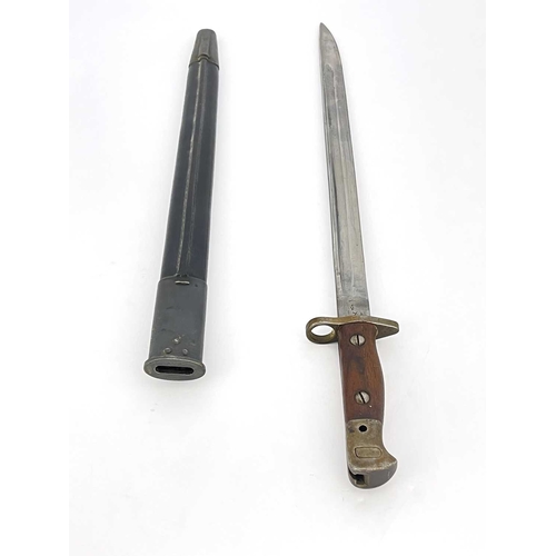 278 - A First World War British 1907 pattern SMLE bayonet by Wilkinson, two piece wooden grip, housed in l... 