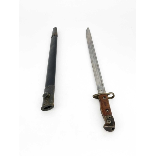 278 - A First World War British 1907 pattern SMLE bayonet by Wilkinson, two piece wooden grip, housed in l... 