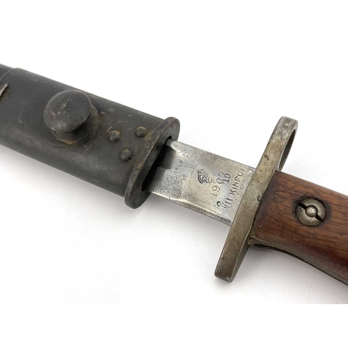 278 - A First World War British 1907 pattern SMLE bayonet by Wilkinson, two piece wooden grip, housed in l... 