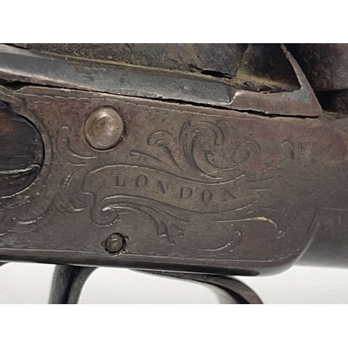 279 - An early 19th century English percussion cap pocket pistol by Stanton of London, three stage cannon ... 