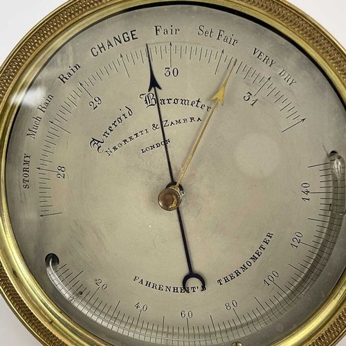 436 - Negretti & Zambra, London, a marine Aneroid Barometer, late 19th/early 20th Century, brass case, 11c... 