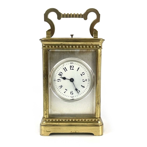 441 - A French repeating carriage clock, early 20th Century, gilt metal corniche case with swing handle, v... 