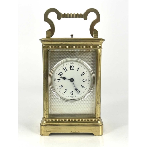 441 - A French repeating carriage clock, early 20th Century, gilt metal corniche case with swing handle, v... 