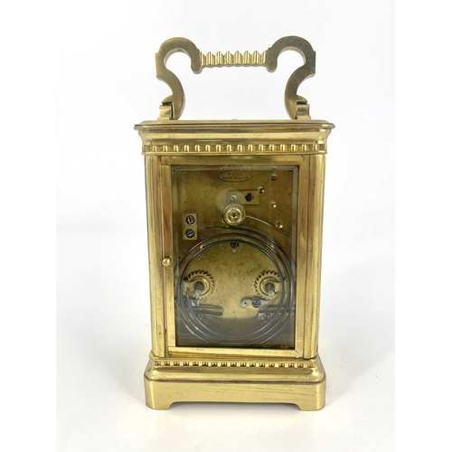 441 - A French repeating carriage clock, early 20th Century, gilt metal corniche case with swing handle, v... 