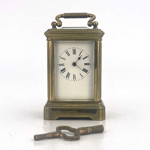 443 - A miniature carriage timepiece, early 20th Century, brass corniche case with visible escapement, whi... 