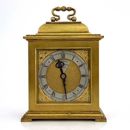 445 - Goldsmiths & Silversmiths, London, a 20th Century boudoir timepiece, brushed brass case in the form ... 