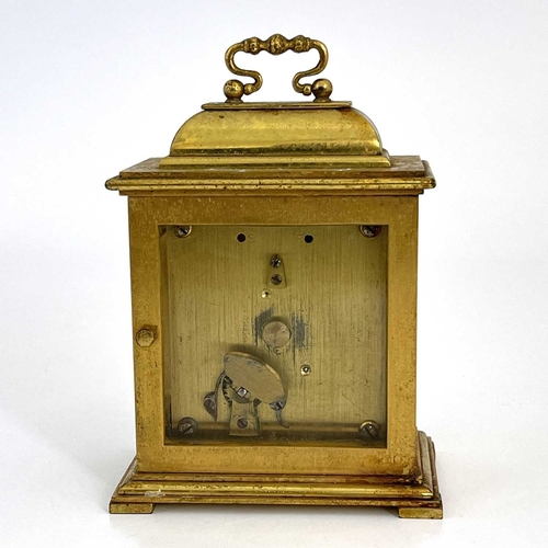 445 - Goldsmiths & Silversmiths, London, a 20th Century boudoir timepiece, brushed brass case in the form ... 