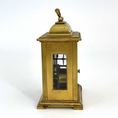 445 - Goldsmiths & Silversmiths, London, a 20th Century boudoir timepiece, brushed brass case in the form ... 