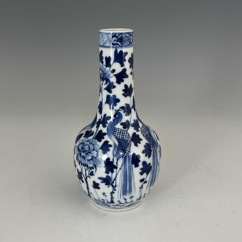 450 - A Chinese bottle vase, 19th Century, decorated in underglaze blue with birds amongst foliage, Kangxi... 