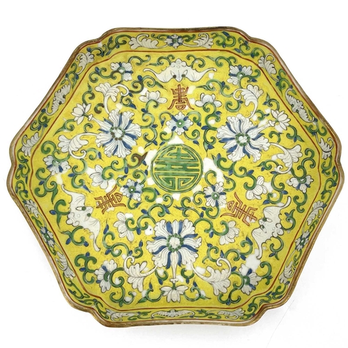 452 - A Chinese famille jaune tray, hexagonal form, decorated in the Qianlong style with lotus flowers and... 