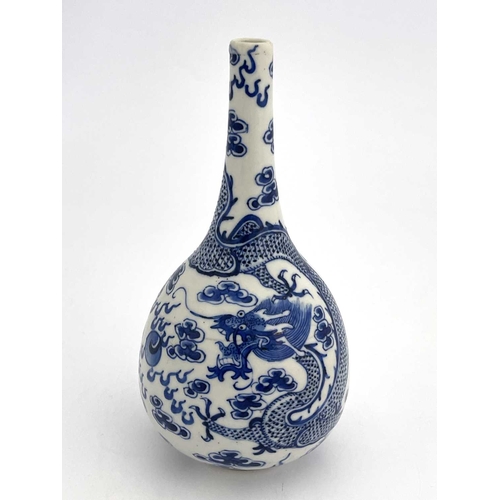 453 - A Chinese blue and white bottle vase, probably Kangxi, painted with dragons and flaming pearl amongs... 