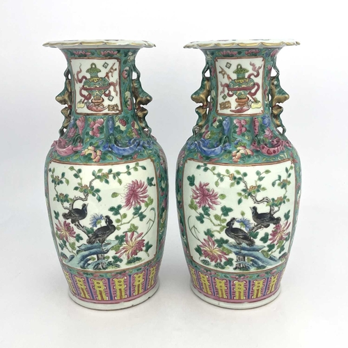 466 - A pair of Chinese Canton famille rose vase, shouldered form with lizard moulded necks and dog handle... 