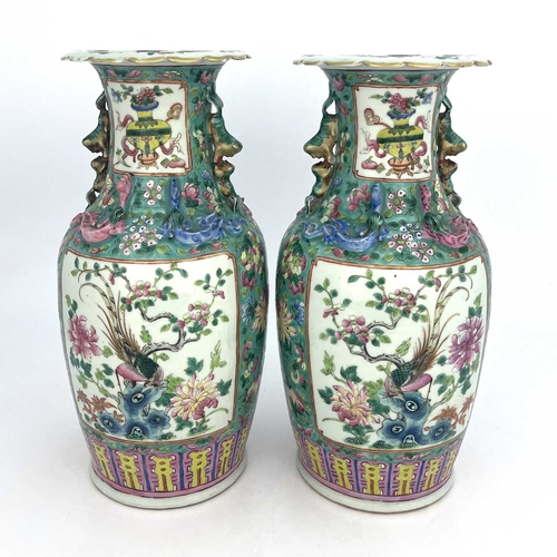 466 - A pair of Chinese Canton famille rose vase, shouldered form with lizard moulded necks and dog handle... 