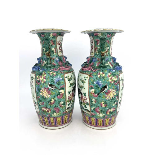 466 - A pair of Chinese Canton famille rose vase, shouldered form with lizard moulded necks and dog handle... 