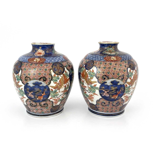 474 - A pair of Japanese Imari vases, Meiji period, 1868-1912, flared openings, of shouldered form, decora... 