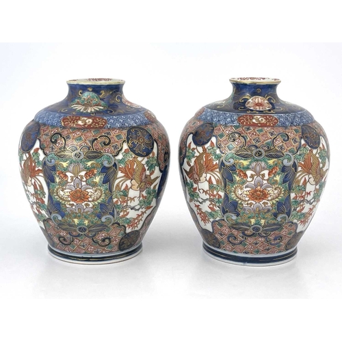 474 - A pair of Japanese Imari vases, Meiji period, 1868-1912, flared openings, of shouldered form, decora... 