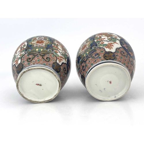 474 - A pair of Japanese Imari vases, Meiji period, 1868-1912, flared openings, of shouldered form, decora... 