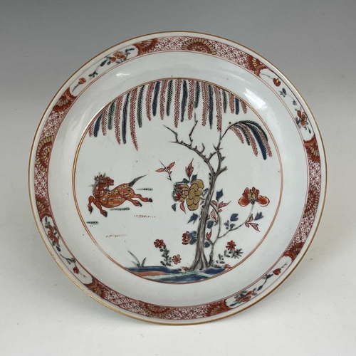 479 - A Chinese porcelain dish, Kangxi period, 1662-1722, decorated in iron red and coloured enamels, depi... 