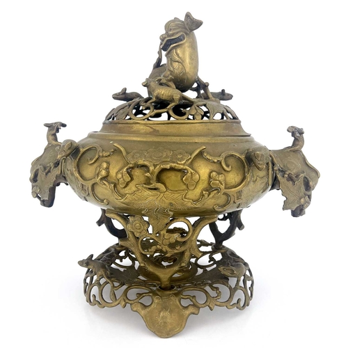 484 - A Chinese reticulated bronze incense burner, in three sections, with stand