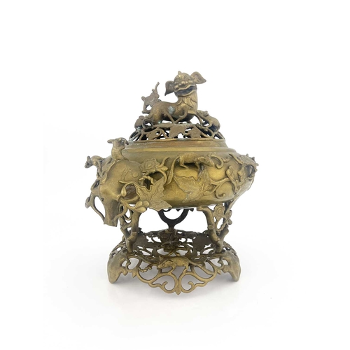 484 - A Chinese reticulated bronze incense burner, in three sections, with stand