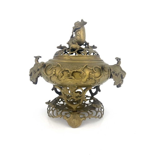 484 - A Chinese reticulated bronze incense burner, in three sections, with stand