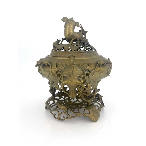 484 - A Chinese reticulated bronze incense burner, in three sections, with stand