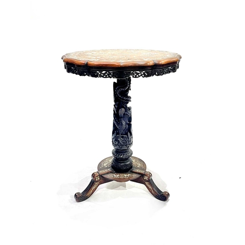 484A - A Chinese hardwood tripod occasional table, mid to late 19th Century, serpentine-edged circular top,... 