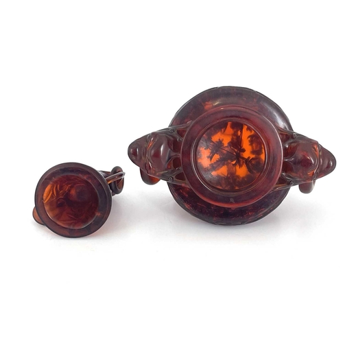 485 - A Chinese pressed cherry amber censer, ring handles and lid, modelled in low relief with foliate scr... 