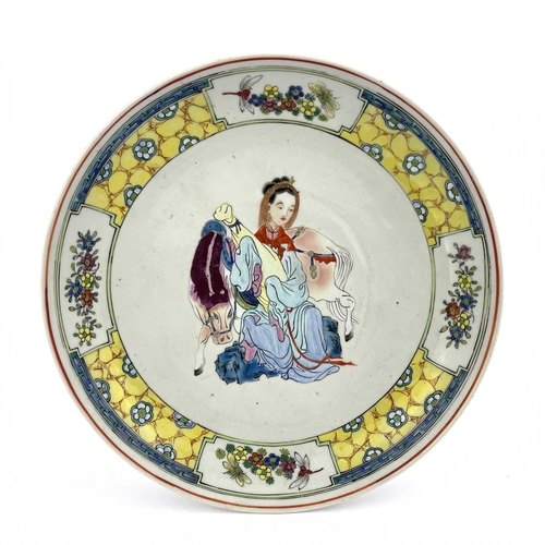 488 - A Chinese famille jaune dish, the central image of Wang Zhaojun in polychrome enamel within a yellow... 