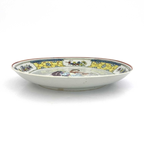 488 - A Chinese famille jaune dish, the central image of Wang Zhaojun in polychrome enamel within a yellow... 