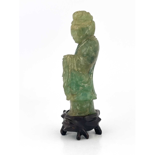 504 - A Chinese carved green quartz figural finial, 19th century or earlier, modelled as Guanyin, standing... 