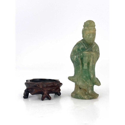 504 - A Chinese carved green quartz figural finial, 19th century or earlier, modelled as Guanyin, standing... 