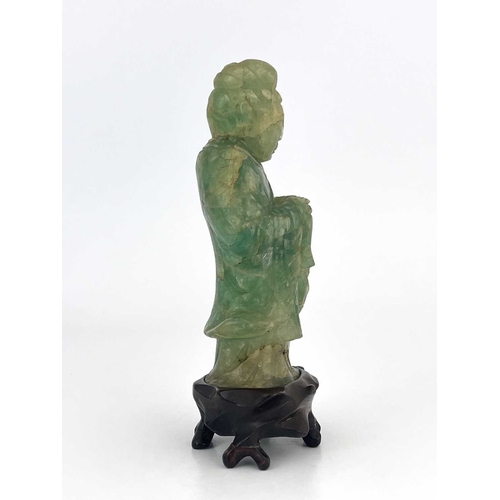 504 - A Chinese carved green quartz figural finial, 19th century or earlier, modelled as Guanyin, standing... 